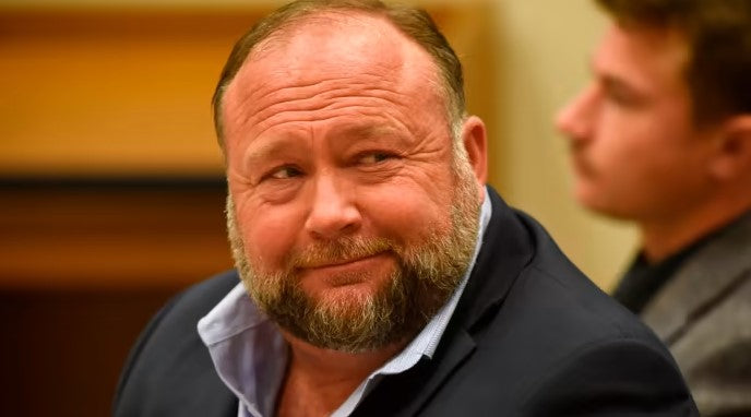 Alex Jones ordered to pay nearly $1bn over Sandy Hook hoax claims